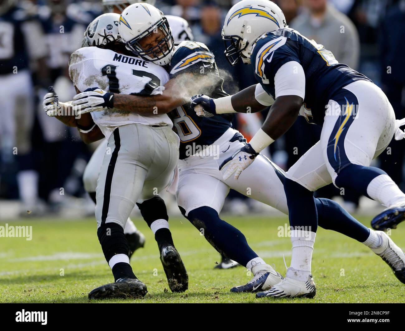 Oakland Raiders punt returner Jacoby Ford is wrapped up by the San ...