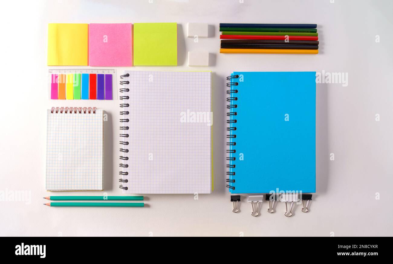 Notebook Eraser Mockup. An empty school notebook,pencil, erasers,stickers on a white ...