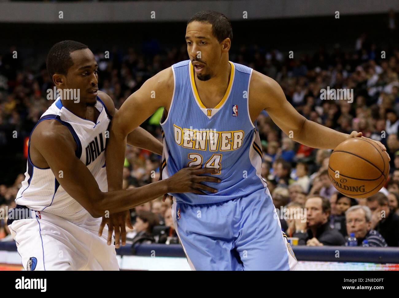 Denver Nuggets point guard Andre Miller (24) attempts to get by Dallas  Mavericks' Rodrigue Beaubois, of Guadeloupe, in the first half of an NBA  basketball game on Friday, Dec. 28, 2012, in