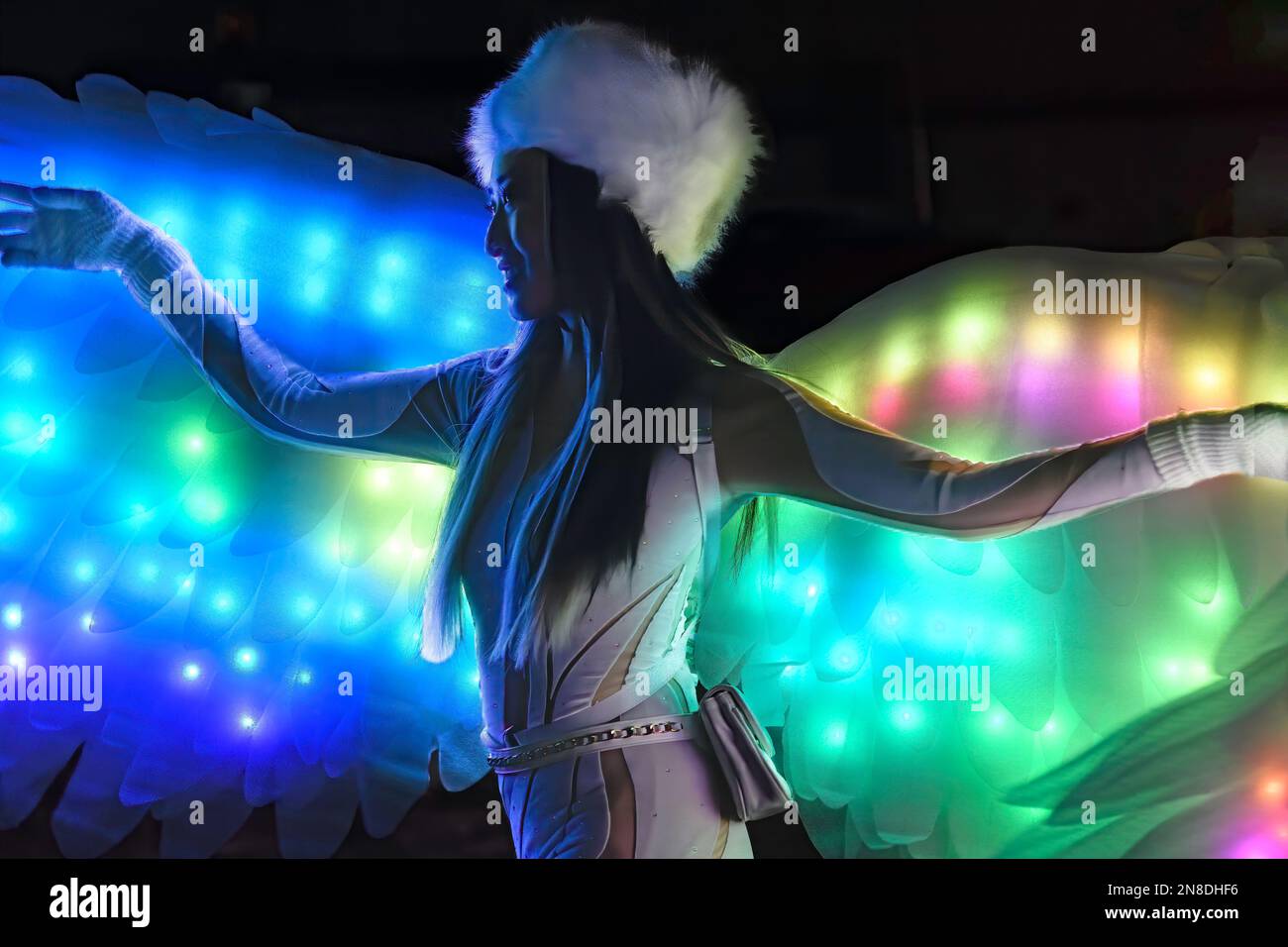 Young Asian girl wearing angel wings at the Chinook Blast Winter Festival, Calgary Alberta Canada Stock Photo