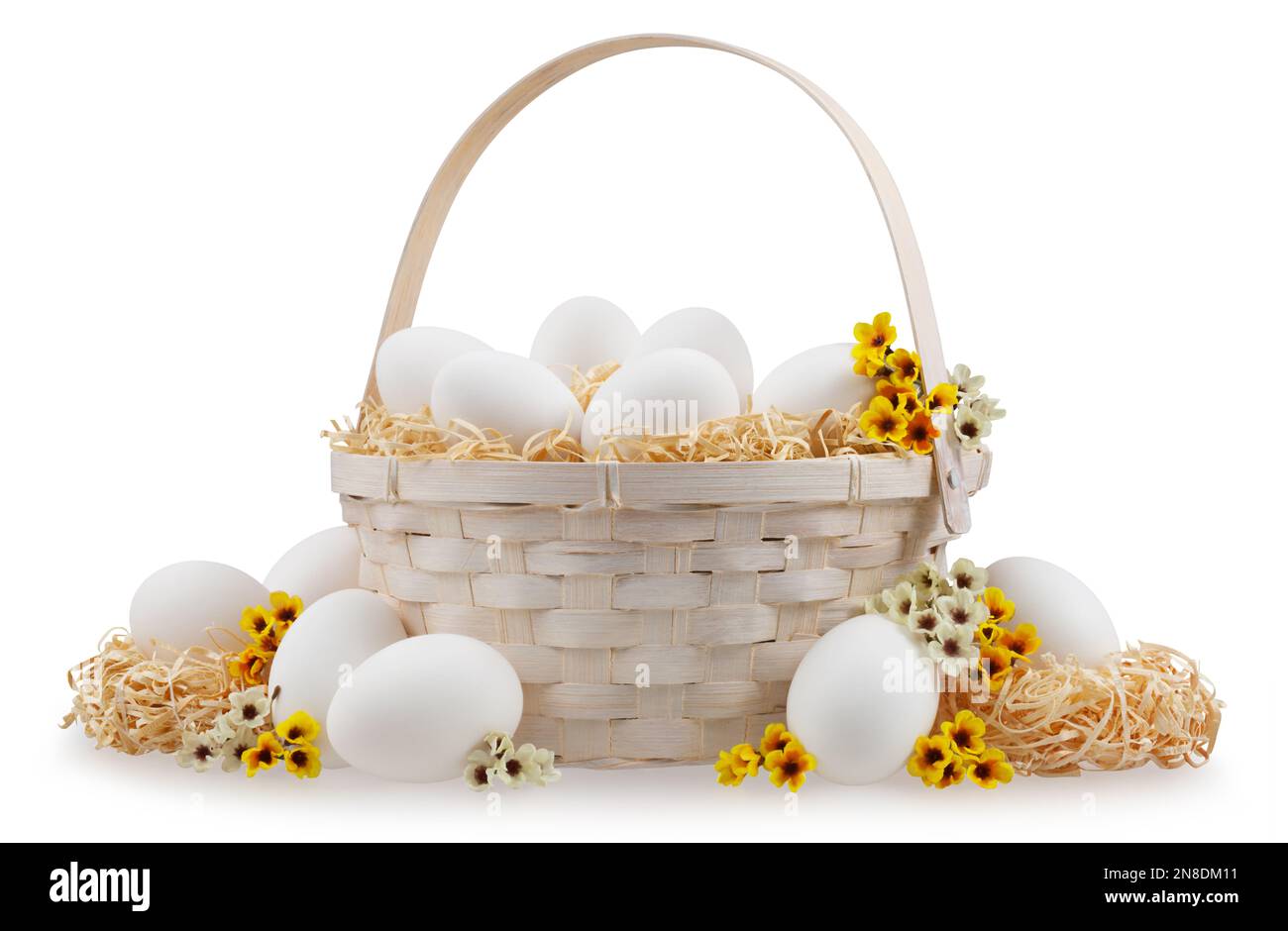 Easter basket full of eggs with flower spring decorations and straw ...