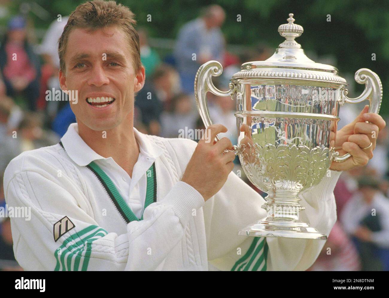 Czech world number one tennis player Ivan Lendl holds aloft the ...