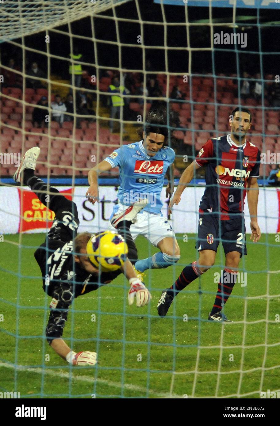 Napoli's Edinson Cavani, of Uruguay, center, scores past Bologna's
