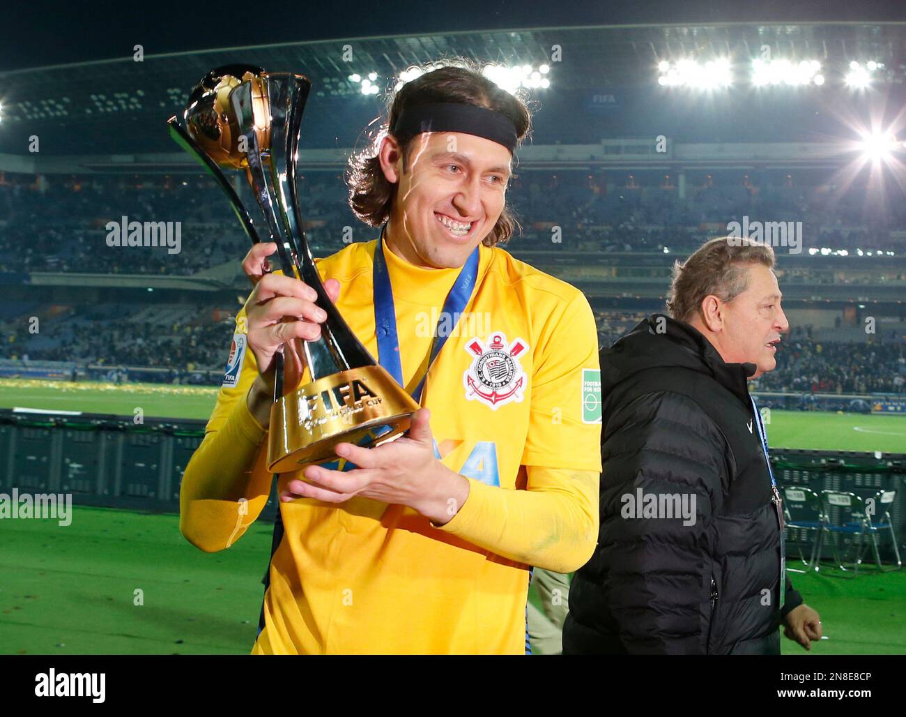 Corinthians' goalkeeper Cassio holds the trophy at the end of the final