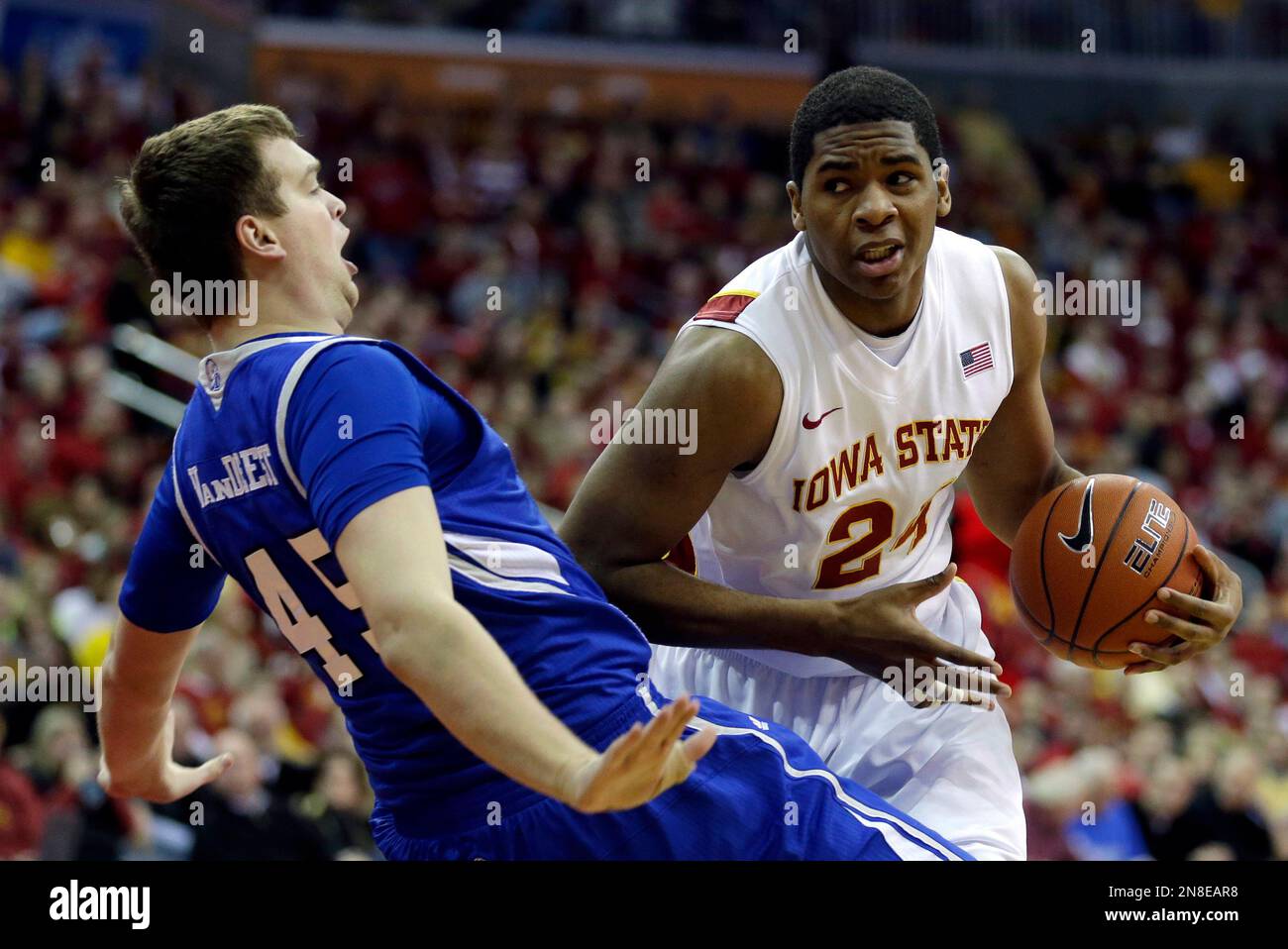 Iowa State center Percy Gibson, right, charges into Drake center Seth