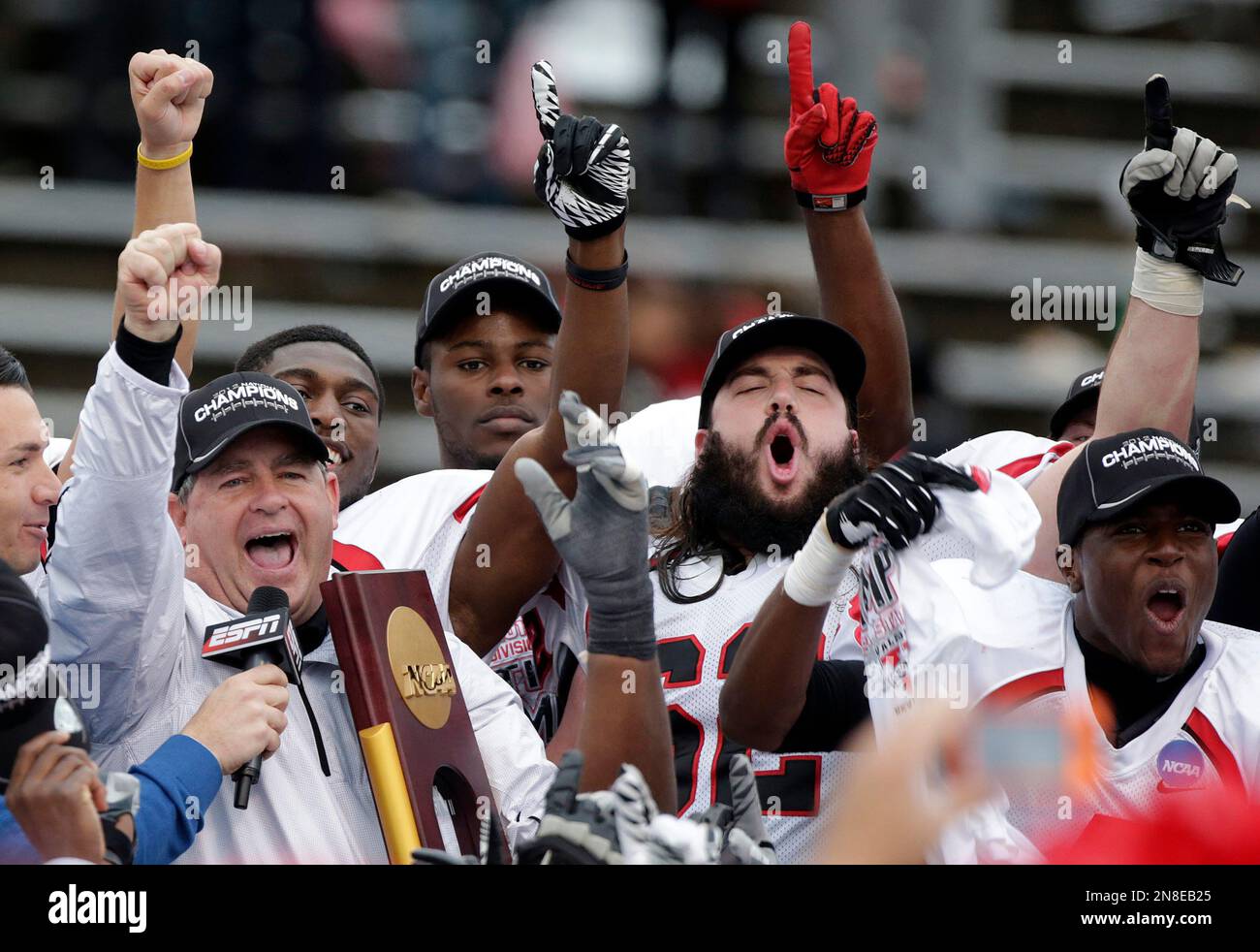 Valdosta State coach David Dean holds up the NCAA Div II national ...