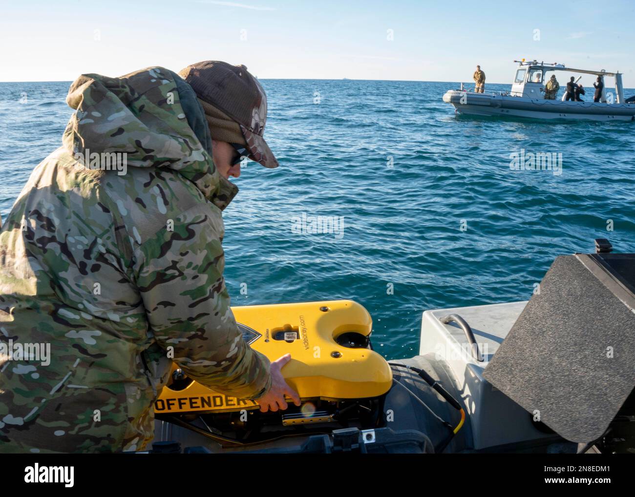 Myrtle Beach, United States of America. 07 February, 2023. A U.S Navy sailors assigned to Explosive Ordnance Disposal Group 2 prepares an remotely operated underwater vehicle during search and recover of the Chinese high-altitude surveillance balloon in the Atlantic Ocean, February 7, 2023 off the coast of Myrtle Beach, South Carolina. The suspected spy balloon was shot down by American fighter aircraft on February 4th after traveling across the continental United States. Credit: MC1 Ryan Seelbach/US Navy Photo/Alamy Live News Stock Photo