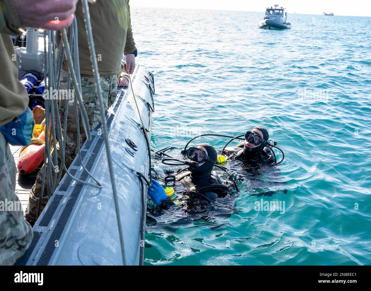 Myrtle Beach, United States of America. 07 February, 2023. U.S Navy sailors assigned to Explosive Ordnance Disposal Group 2 prepare to dive in search for debris during recover of the Chinese high-altitude surveillance balloon in the Atlantic Ocean, February 7, 2023 off the coast of Myrtle Beach, South Carolina. The suspected spy balloon was shot down by American fighter aircraft on February 4th after traveling across the continental United States. Credit: MC1 Ryan Seelbach/US Navy Photo/Alamy Live News Stock Photo