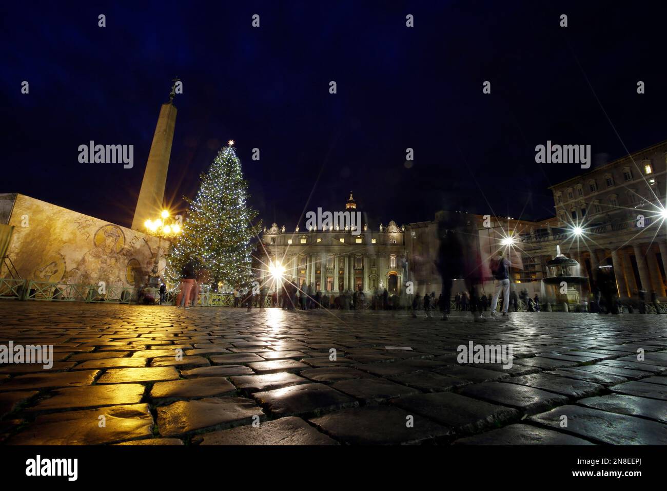 The 24 meters (78.74 feet) Christmas tree is lit in St. Peter's square at  the Vatican, Friday, Dec. 14, 2012. The Christmas season kicks off Friday  at the Vatican with the traditional