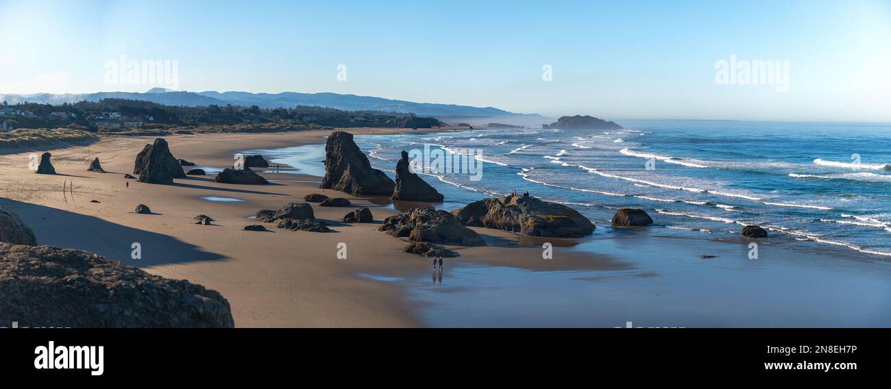Panoramic view of Bandon Beach with many rock formations and people
