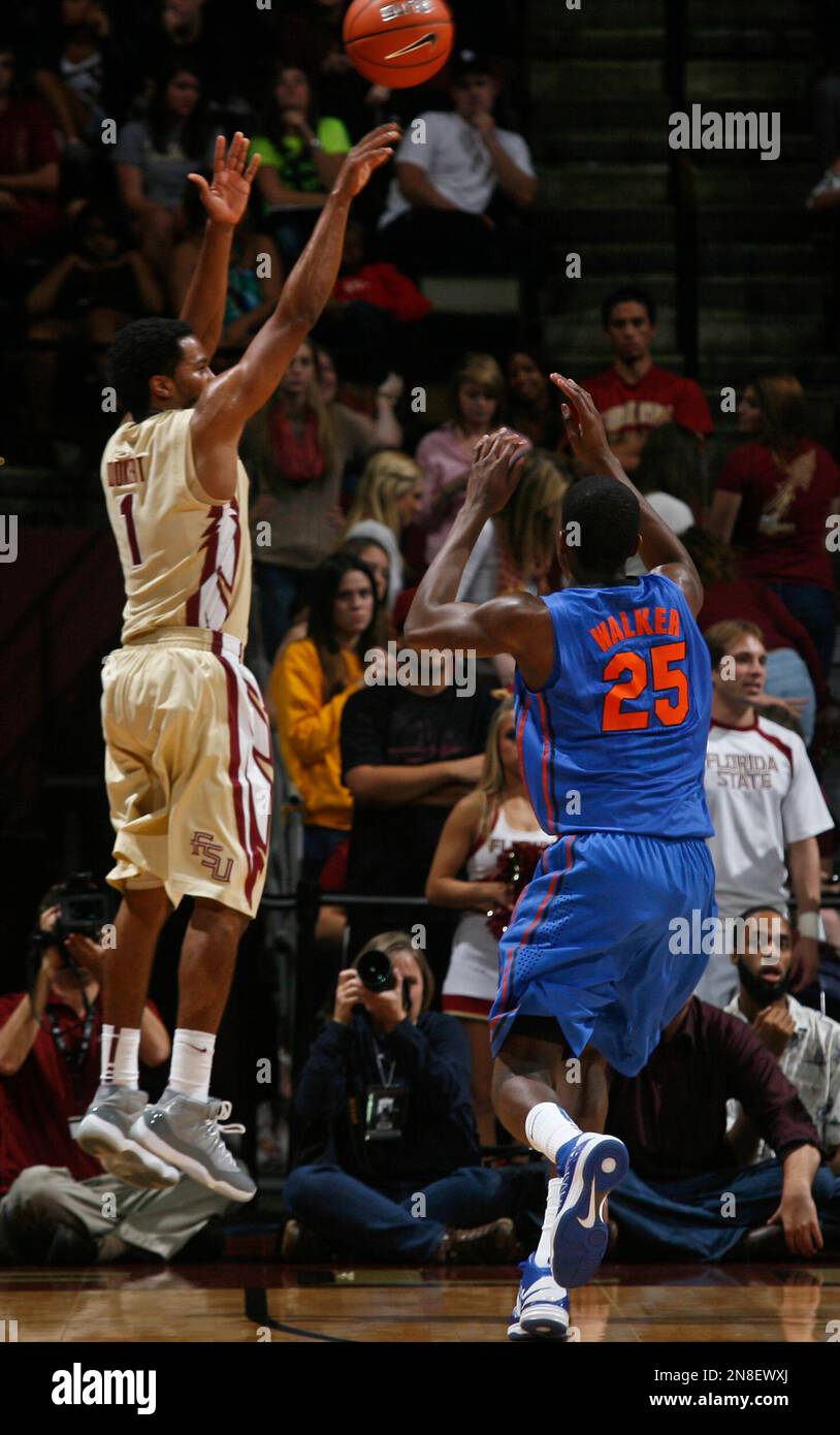 Florida State guard Devon Bookert (1) makes a threepoint shot as