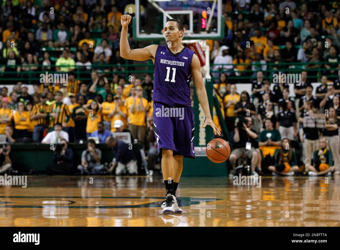 Northwestern guard Reggie Hearn (11) moves the ball against Baylor