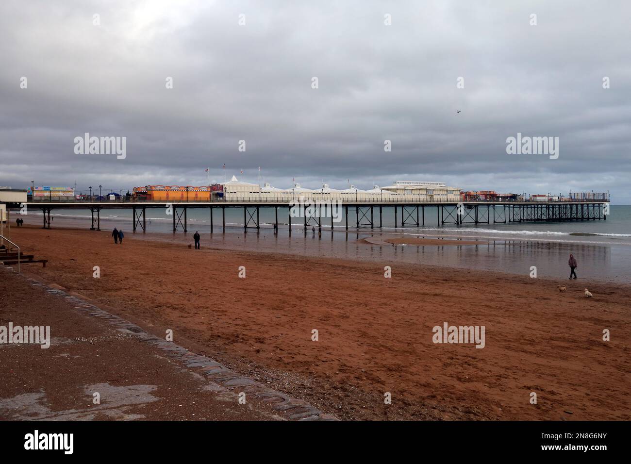 Paignton beach and Paignton pier and promenade at low tide. Taken