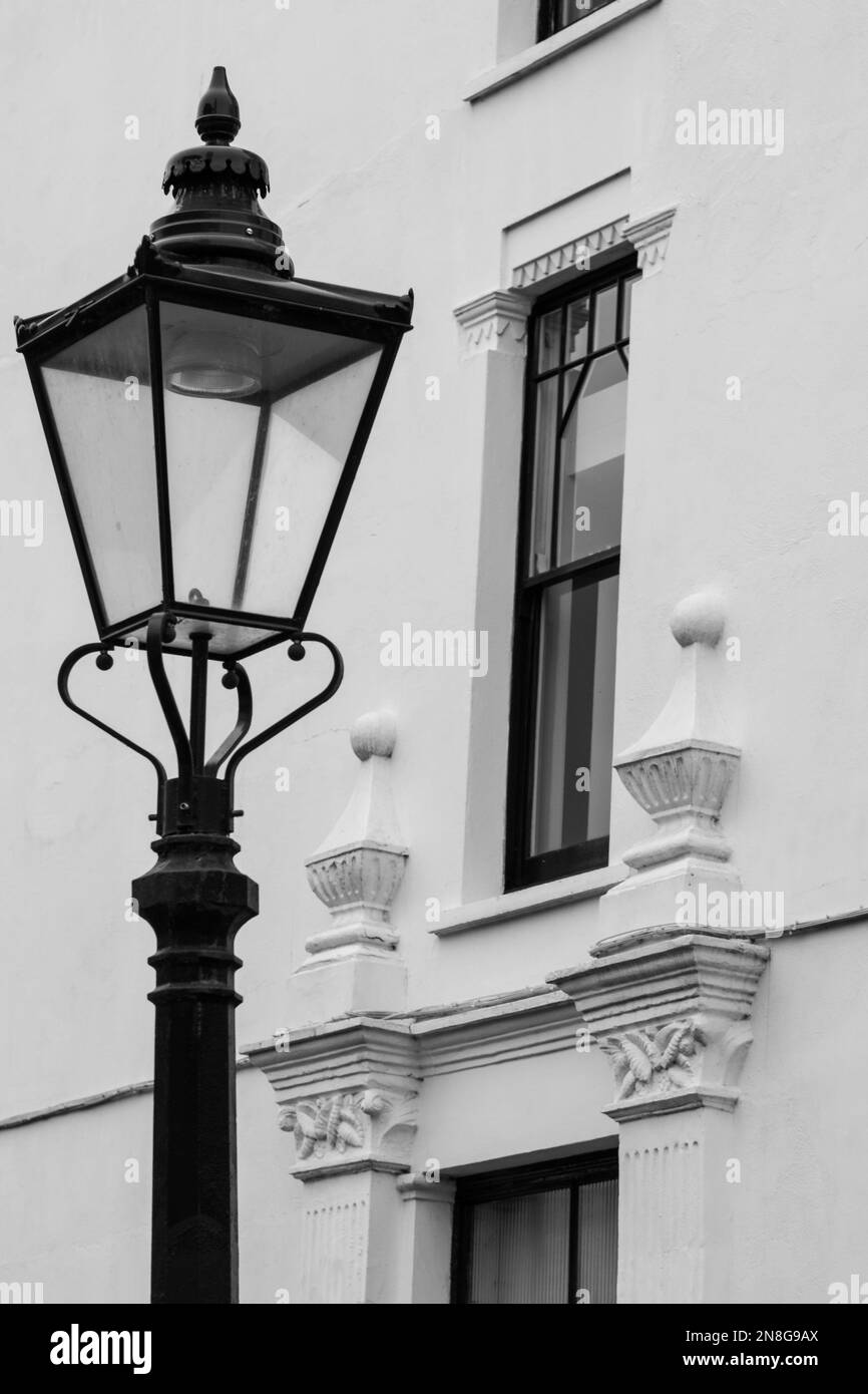 Northcote Mansions in Hampstead, London, UK. Beautiful residential white painted building with architectural detail. Stree lamp in foreground. Stock Photo
