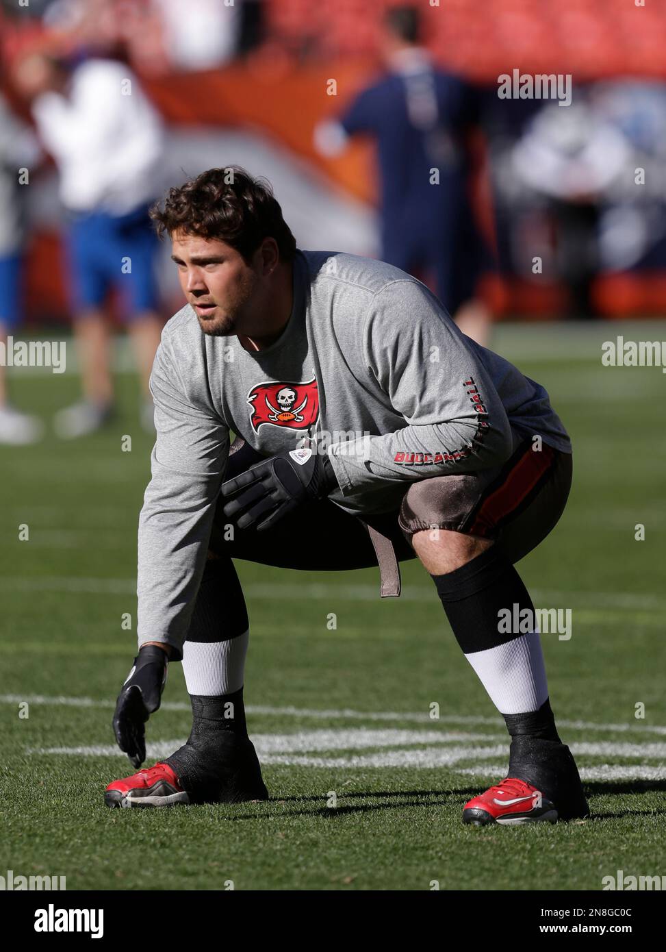 Tampa Bay Buccaneers center Cody Wallace (74) warms up before an NFL  football game between the Denver Broncos and the Tampa Bay Buccaneers,  Sunday, Dec. 2, 2012, in Denver. (AP Photo/Julie Jacobson, image size:973x1390