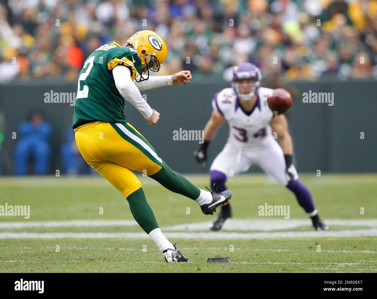 Green Bay Packers kicker Mason Crosby kicks off during the first half of an NFL football game