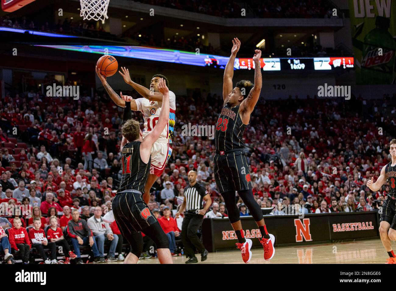 Nebraska's Jamarques Lawrence (10) makes a lay up against Wisconsin's Max Klesmit (11) and