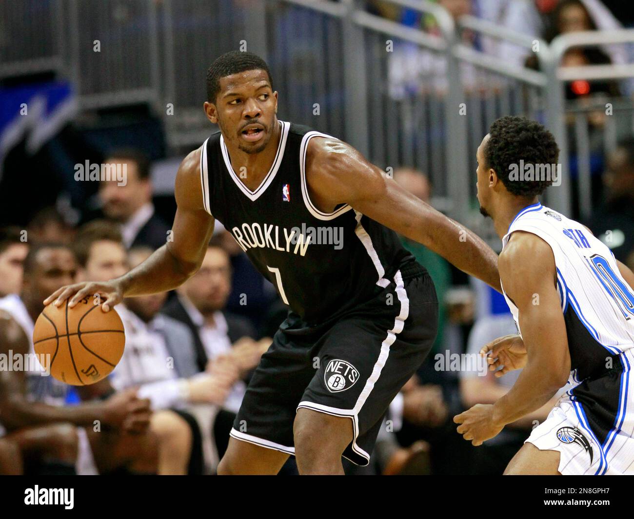Brooklyn Nets' Joe Johnson (7) looks to pass the ball around Orlando