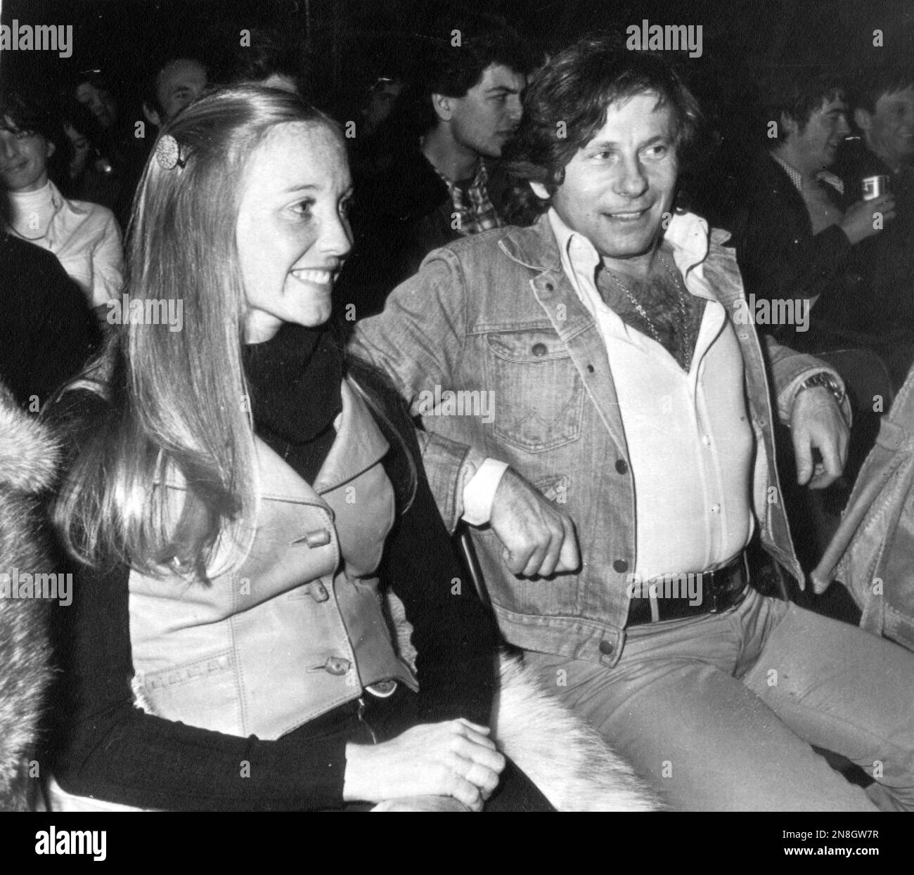 Film director Roman Polanski sits with Karen Pankow at a concert by the