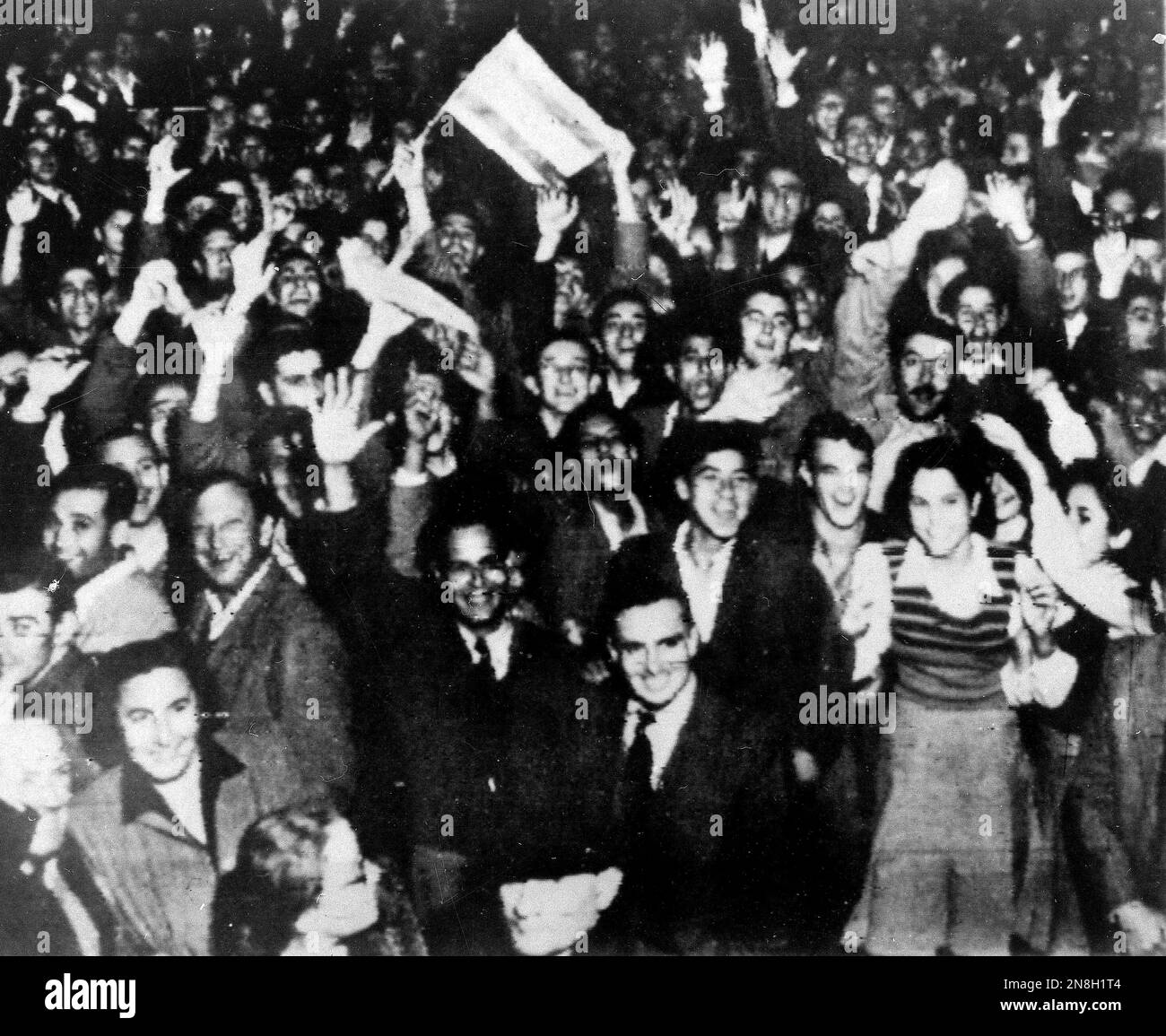 FILE - In this Nov. 29, 1947 file photo, Jewish residents wave