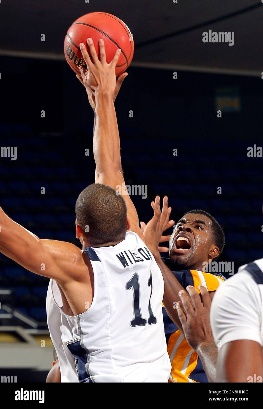 Drexel's Frantz Massenat, right, shoots as Rice's Ross Wilson defends