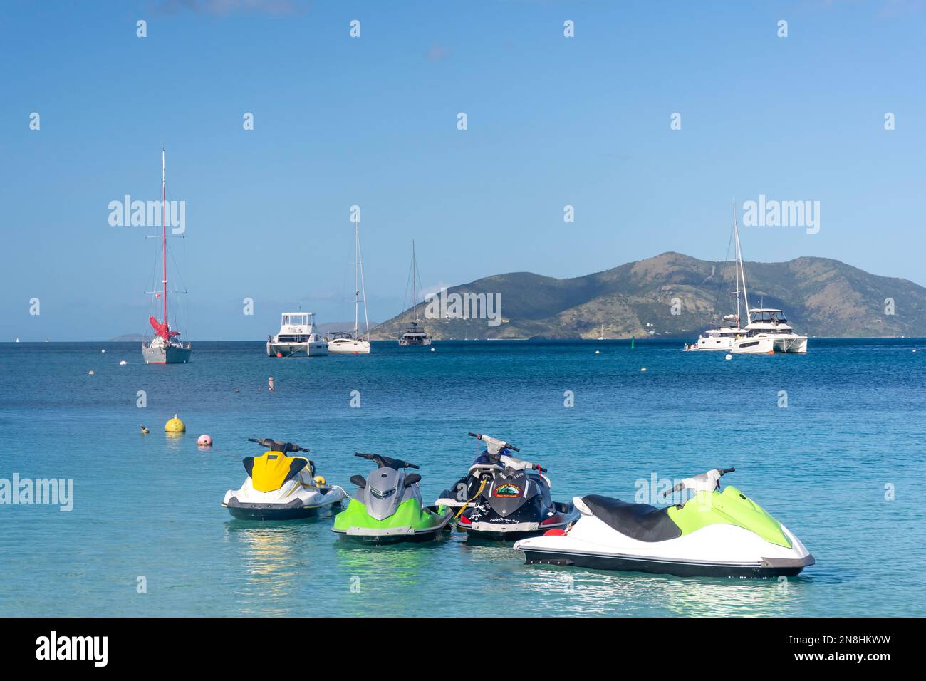 Ski-jets moored off beach, Cane Garden Bay, Tortola, The British Virgin Islands (BVI), Lesser Antilles, Caribbean Stock Photo
