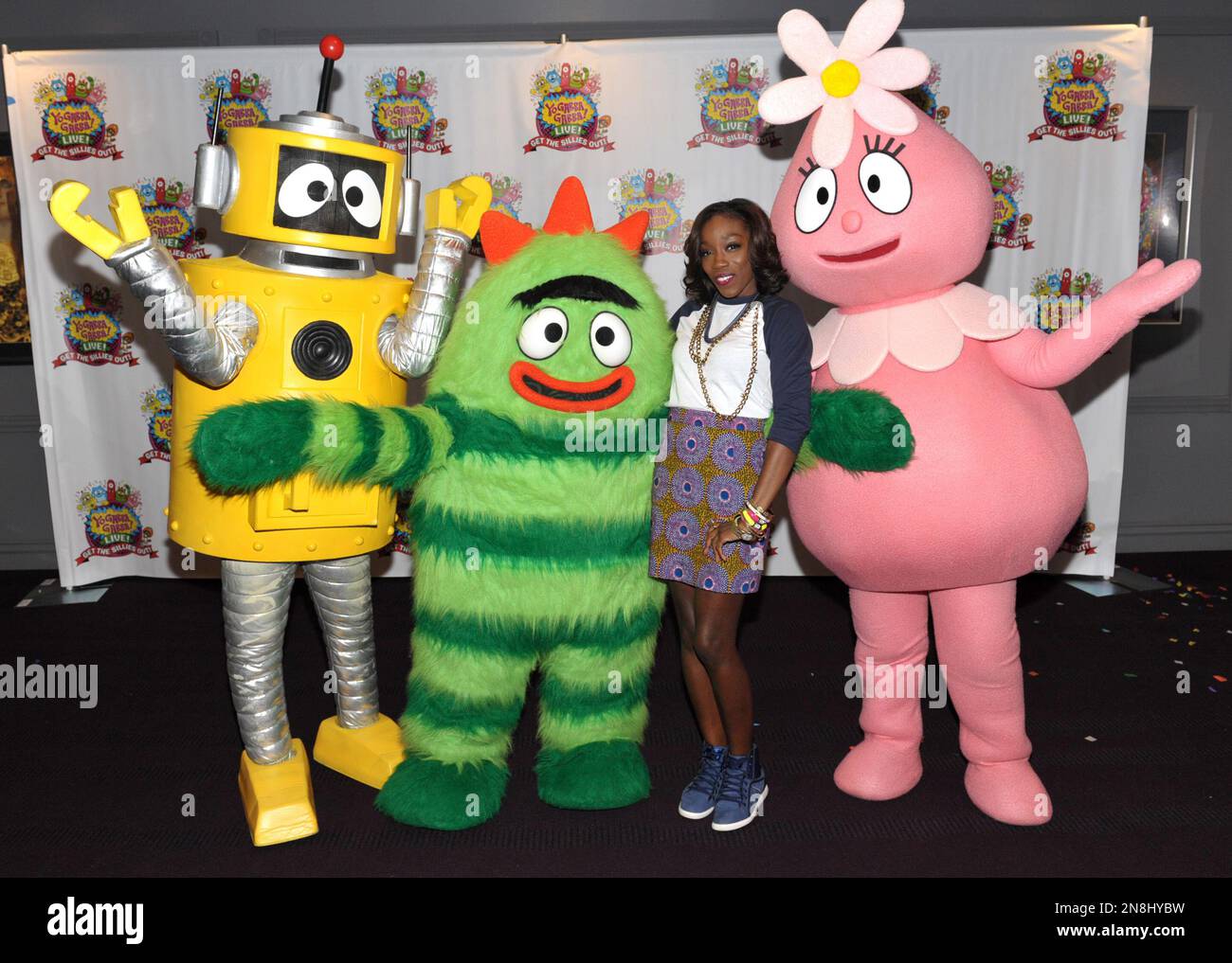 Estelle Swaray, 2nd from right, poses with Plex, Brobee and Foofa