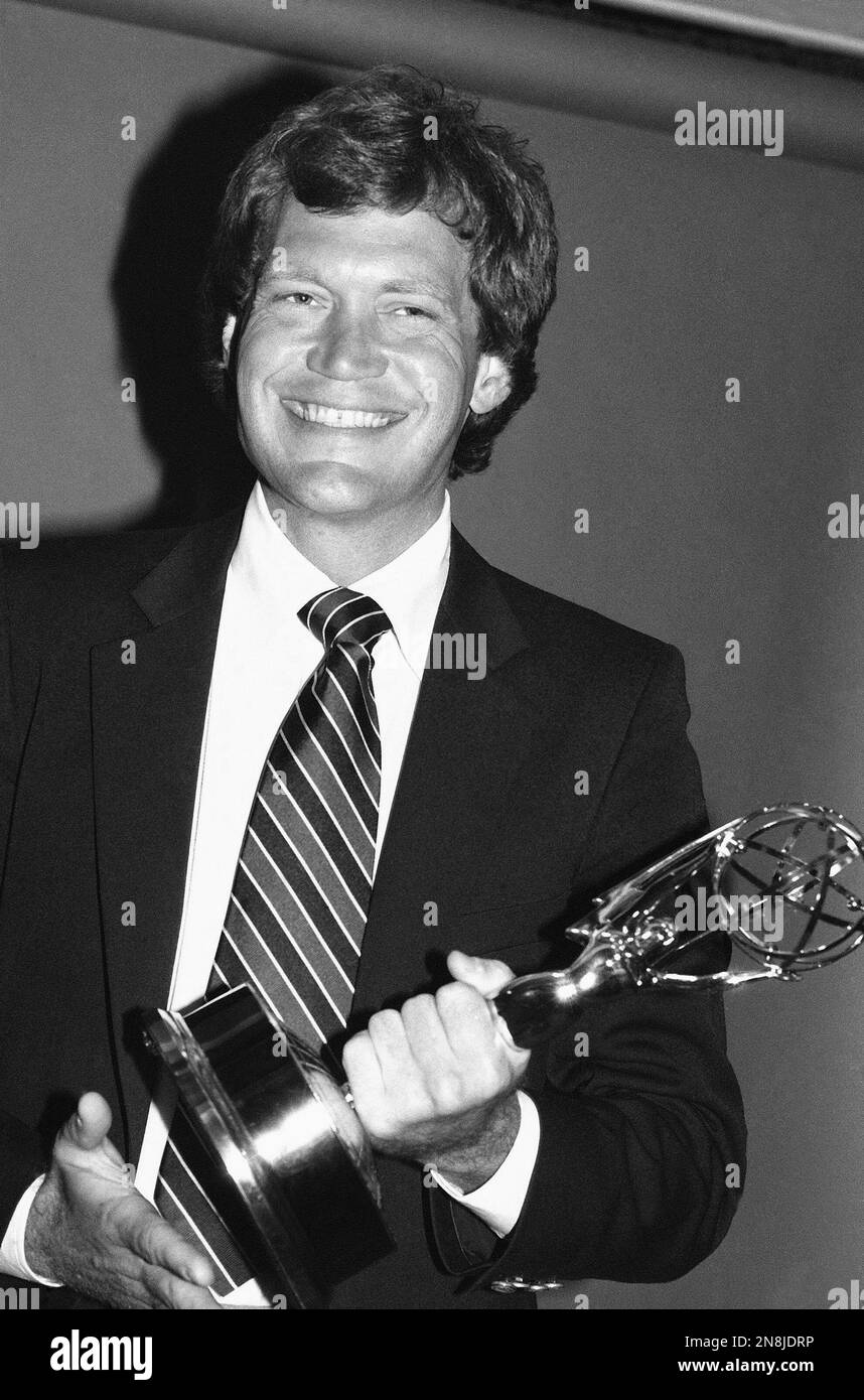 Entertainment media smiling standing television show trophy hires