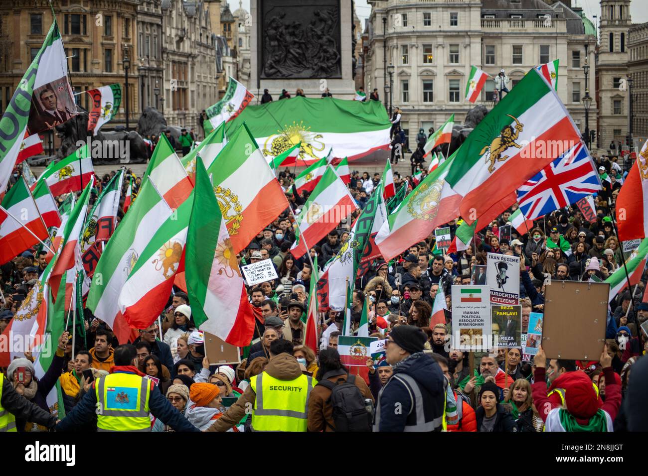 London, UK - 11 Feb 2023: As today marks the 44th anniversary of the Islamic Revolution in Iran. After more than five months of continuous protest in support of the woman, life, freedom movement, Thousands of protesters gathered in Trafalgar Sq. to denounce the Regime in Iran.  Protesters were holding banners with anti-regime symbols, such as Mahsa Amini’s picture and the Shir-o-Khorshid (Lion and Sun) flag of Iran—the flag, or its emblem, were part of Iranian national identity for centuries—which was changed after the Islamic Revolution in 1979.   Credit: Sinai Noor/Alamy Live News Stock Photo