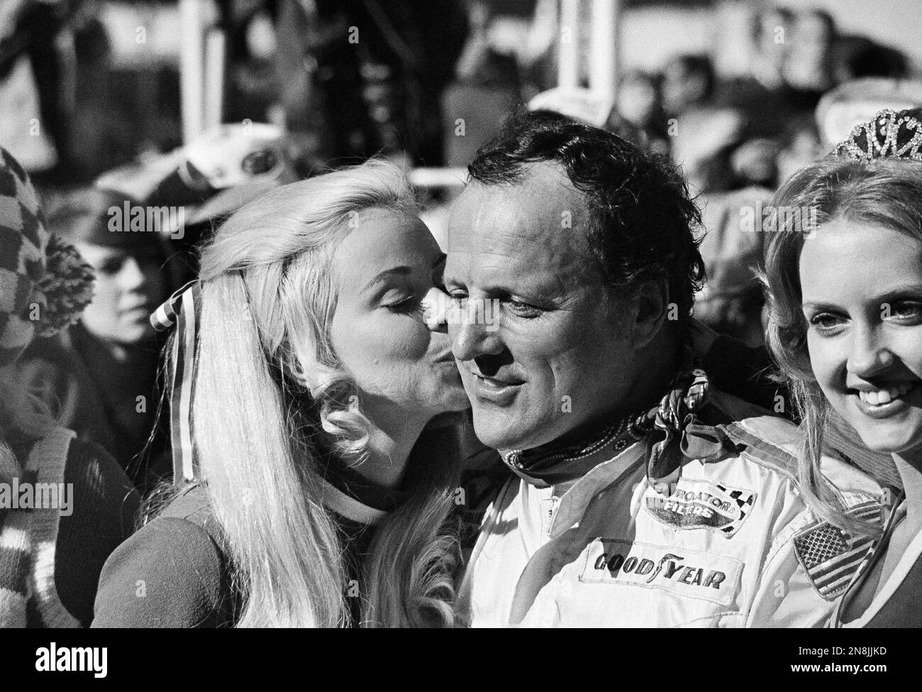 Daytona 500 winner A.J. Foyt of Houston, Texas, gets a big kiss from ...