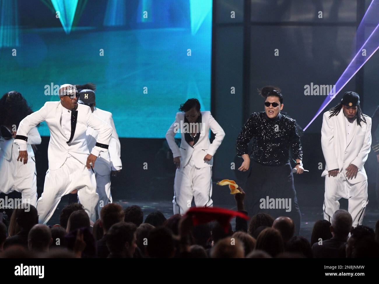 MC Hammer, left, dances as PSY performs “Gangnam Style” at the 40th