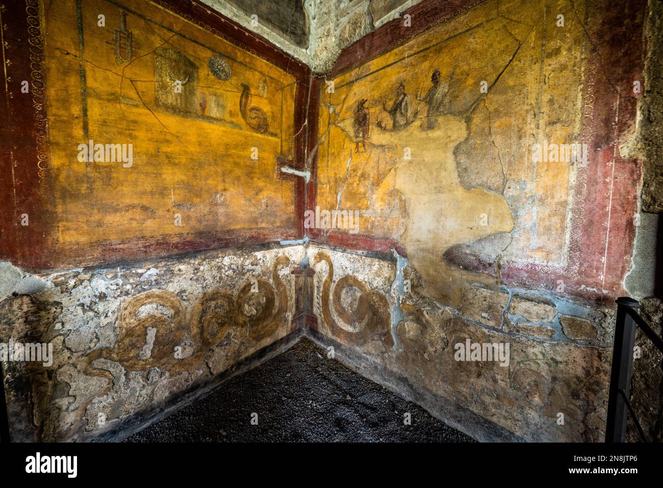 Room of well preserved frescoes in the Casa Degli Amorini in the ruins of Pompeii Stock Photo