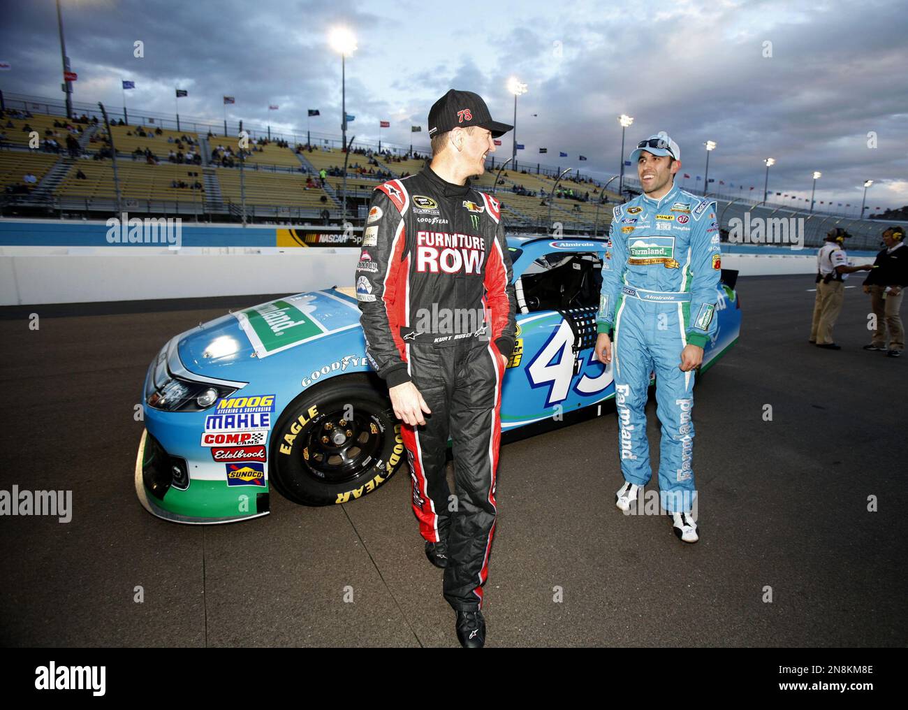 NASCAR driver Kurt Busch, left ,with Aric Almirola, right, following