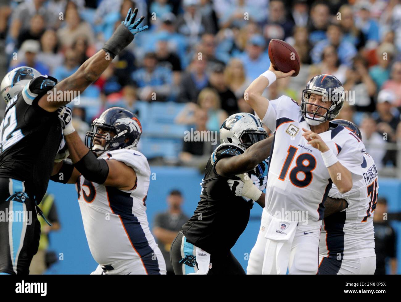 Denver Broncos quarterback Peyton Manning (18) throws a pass during an ...
