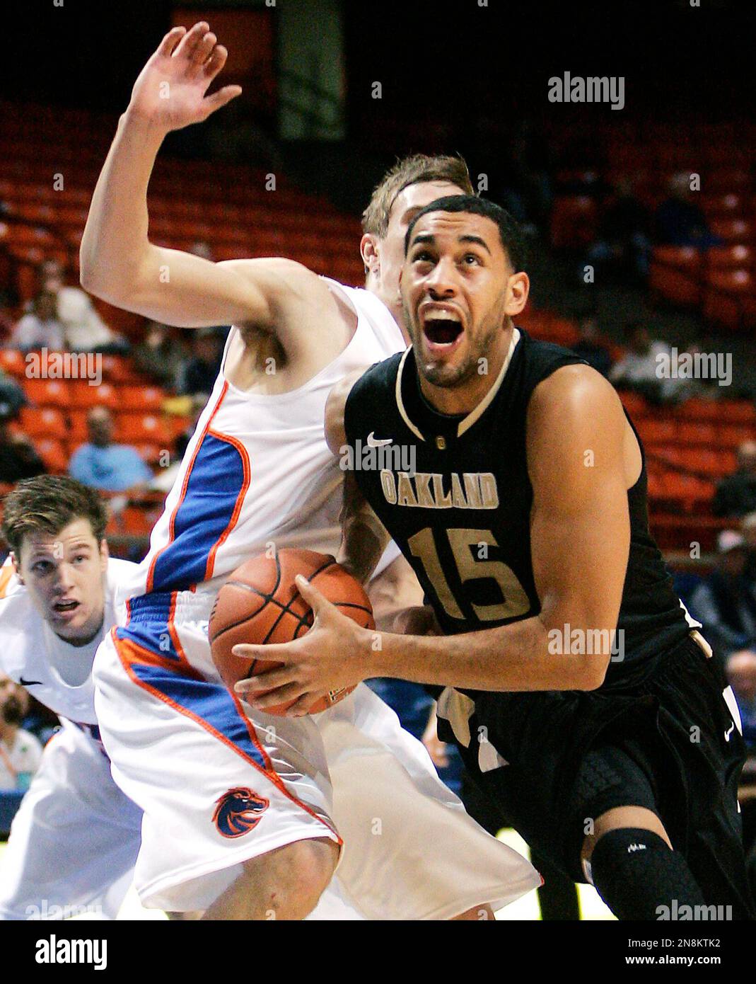 Oakland's Drew Valentine (15) drives the basket against Boise State's ...