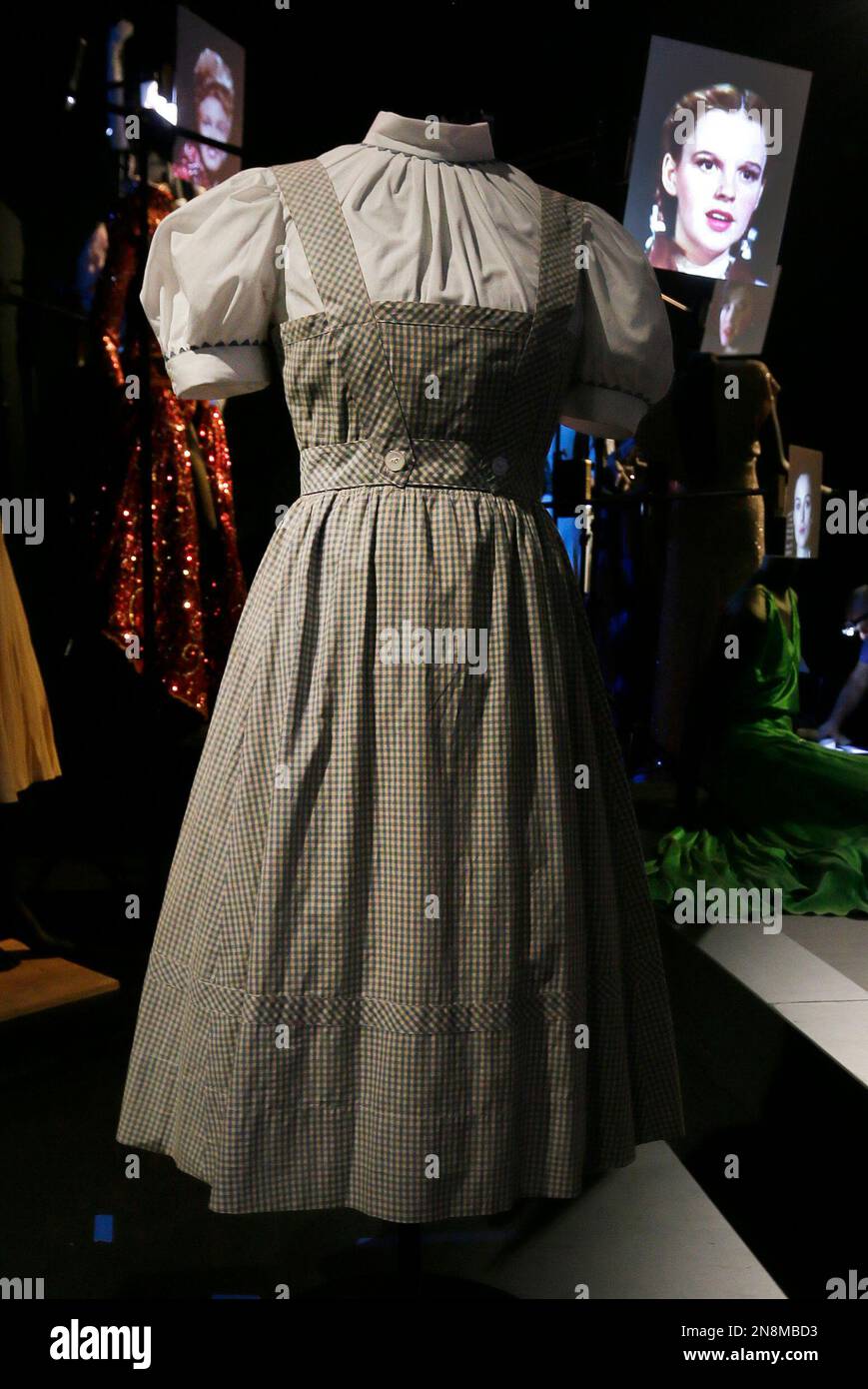 In this Tuesday, Oct. 16, 2012 photo, the blue-and-white gingham pinafore  dress worn by Judy Garland in her iconic role of Dorothy designed by Adrian  for the 1939 film "The Wizard Of