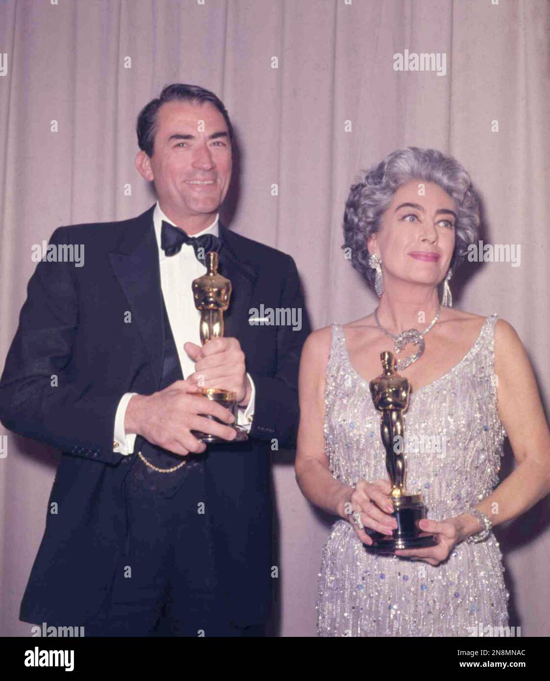 American actor Gregory Peck with his Oscar after winning his first ...