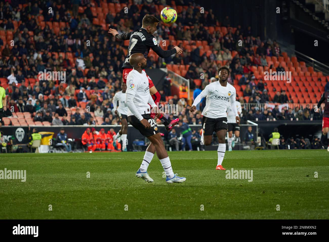 Alejandro Berenguer Remiro of Atheltic Club (L) and Dimitri Foulquier of Valencia CF (R) in action during the J21 Liga Santander  at Mestalla stadium Stock Photo
