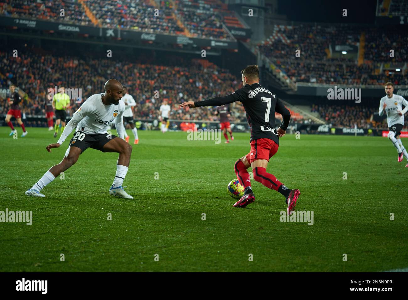 Dimitri Foulquier of Valencia CF (L) and Alejandro Berenguer Remiro of Atheltic Club (R) in action during the J21 Liga Santander  at Mestalla stadium Stock Photo