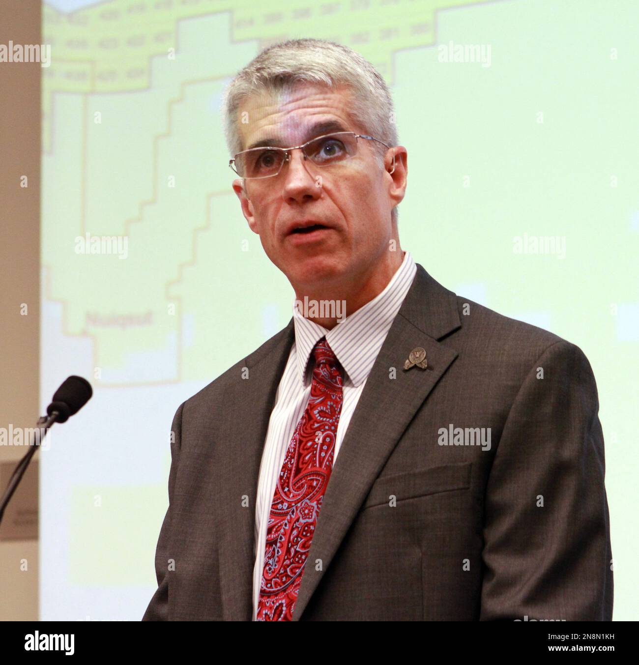Alaska Division of Oil and Gas Director Bill Barron reads bids for