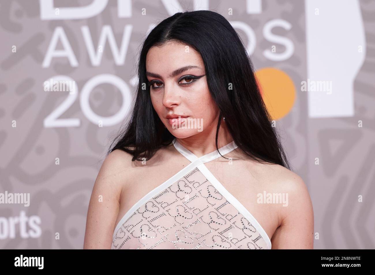 Charli XCX poses for photographers upon arrival at the Brit Awards 2023