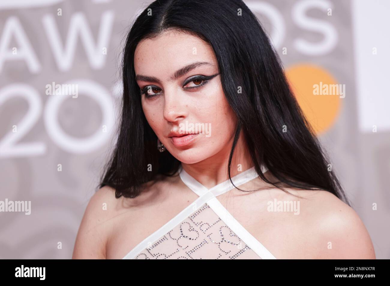 Charli XCX poses for photographers upon arrival at the Brit Awards 2023