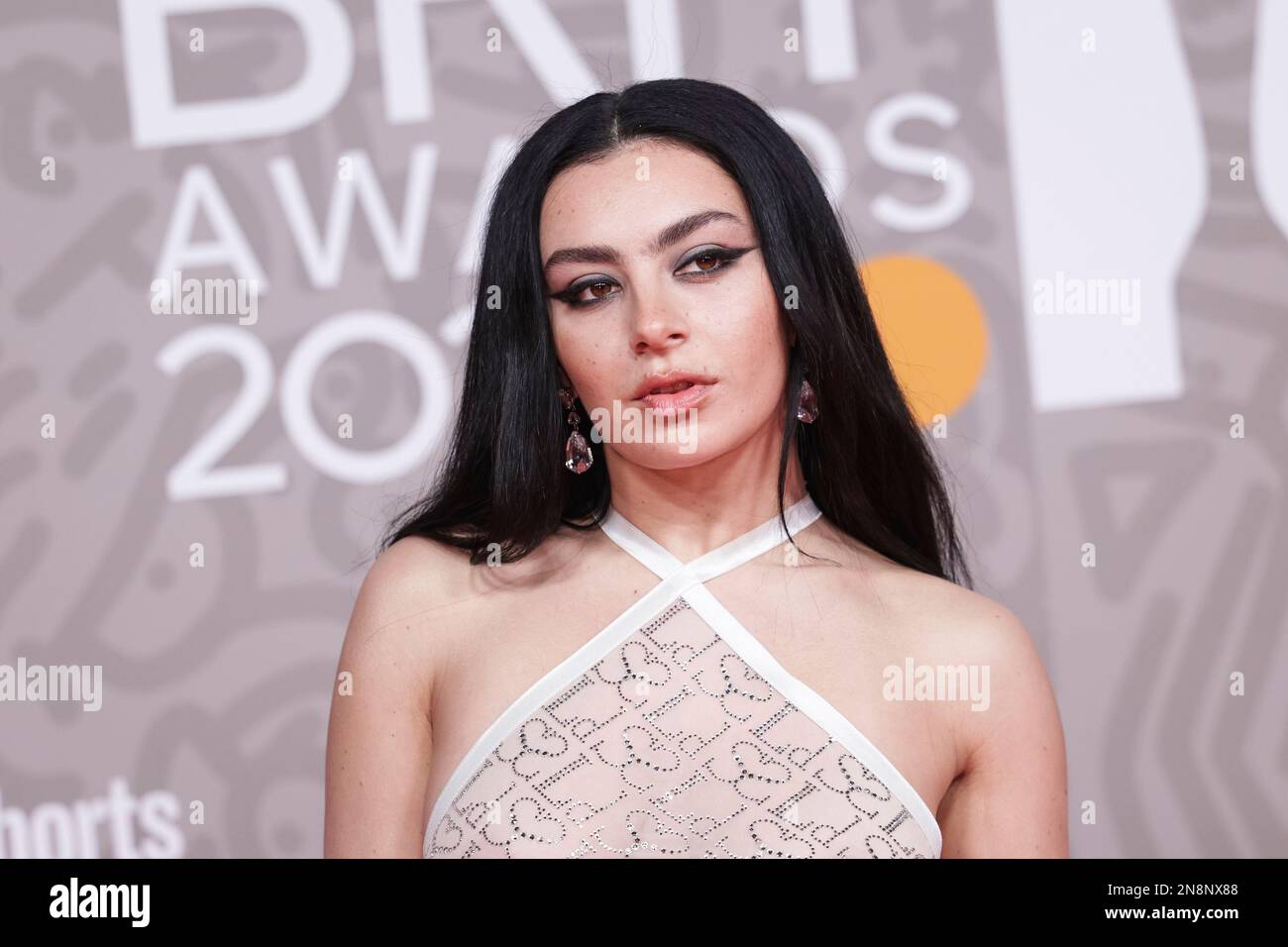 Charli XCX poses for photographers upon arrival at the Brit Awards 2023