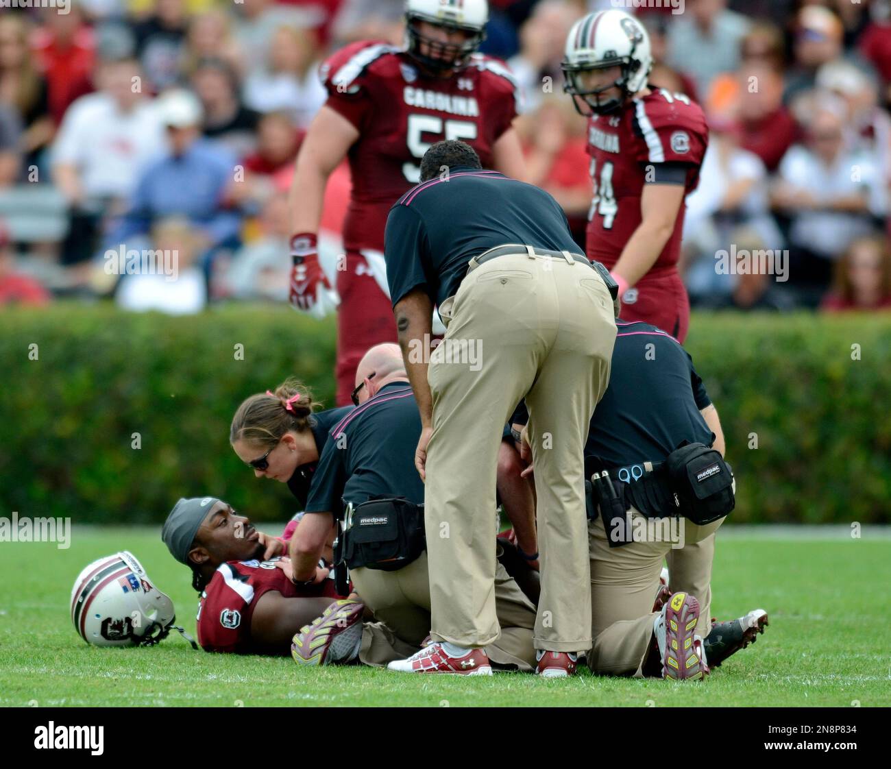 South Carolina running back Marcus Lattimore is comforted by a trainer after being injured