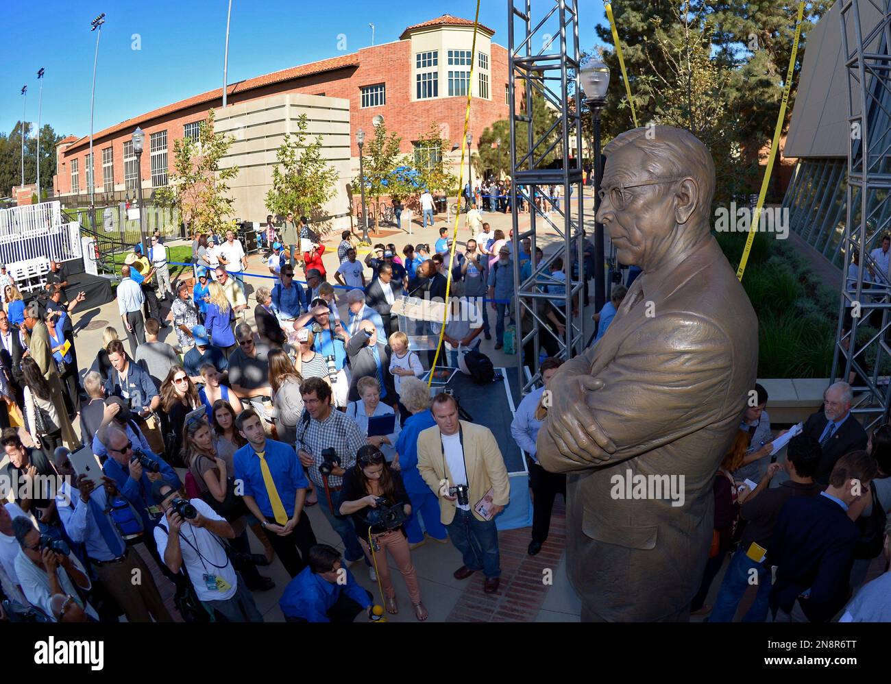 Onlookers view a statue of legendary UCLA men's basketball coach John ...
