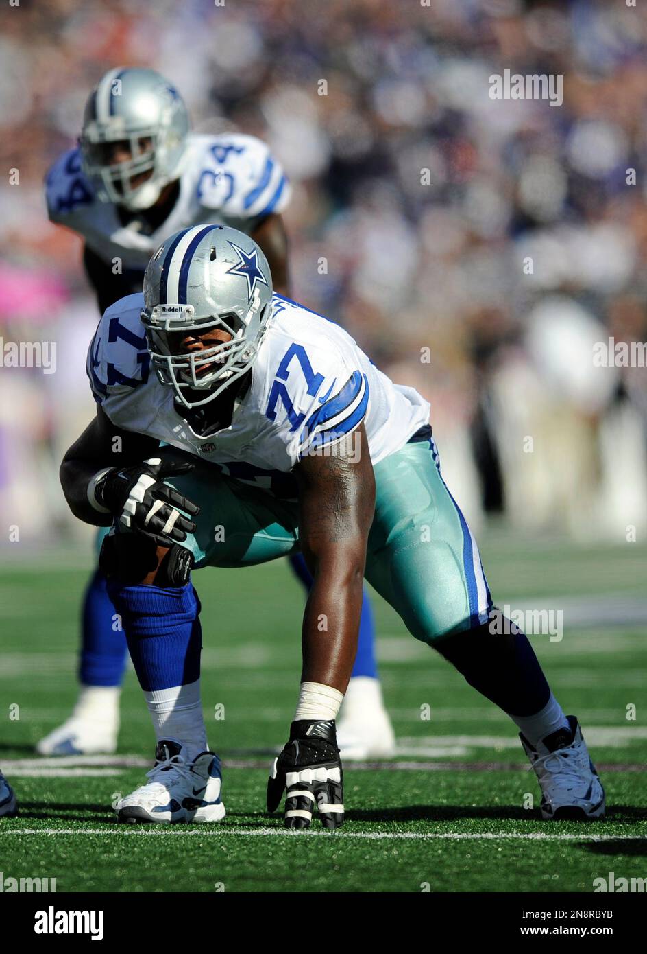 New York Giants defensive end Osi Umenyiora (72) applies pressure to Dallas  Cowboys tackle Tyron Smith (77) in the second quarter in week 1 of the NFL  season at MetLife Stadium in