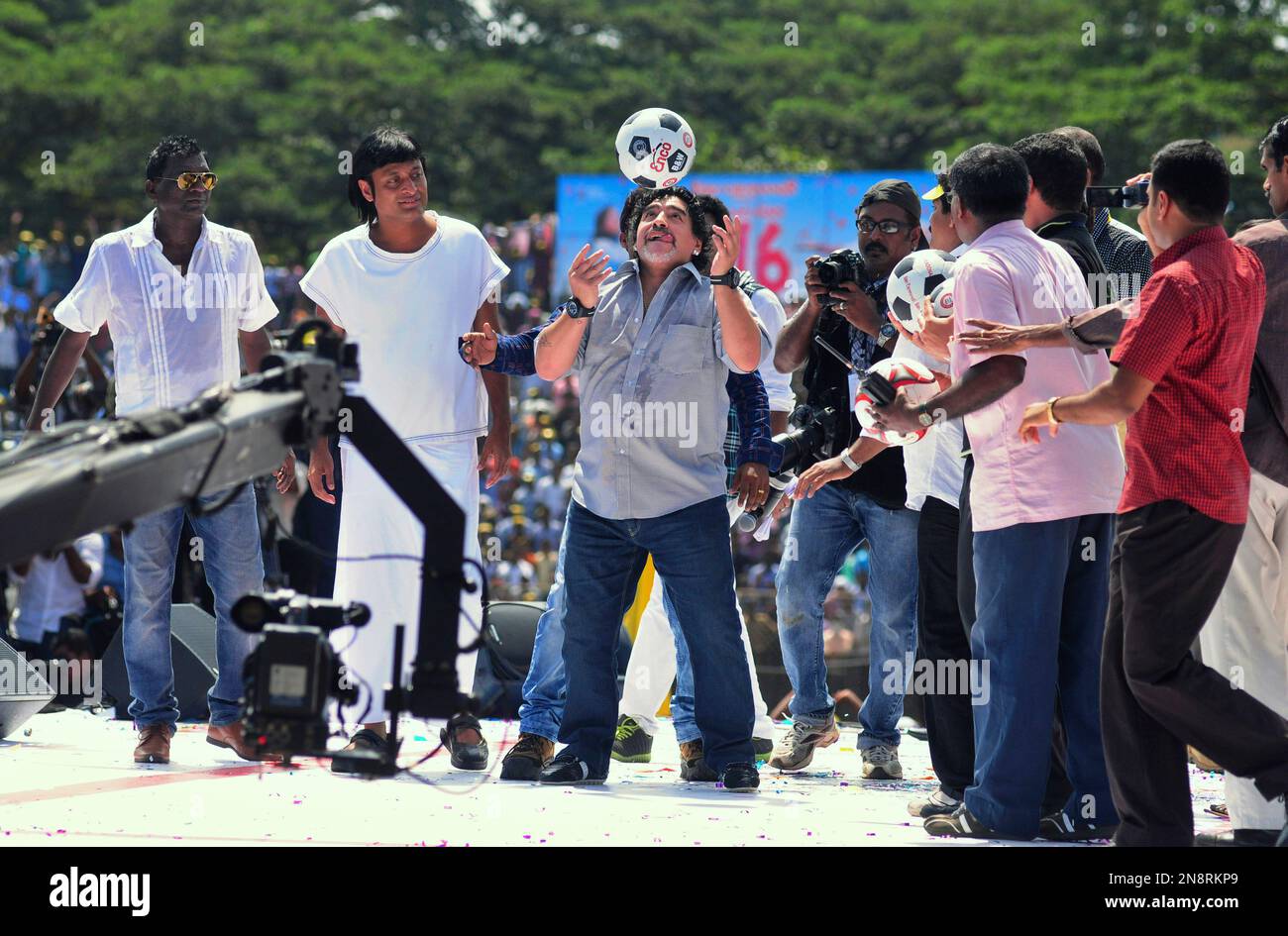 Argentine soccer legend Diego Maradona, center, entertains fans in
