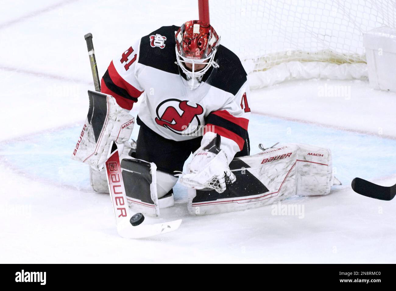 New Jersey Devils goalie Vitek Vanecek stops a Minnesota Wild shot