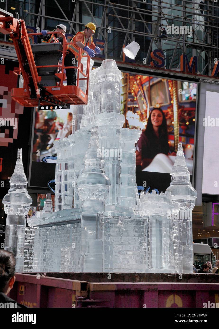 Workers dismantle a threestory castle made of ice in New York's Times