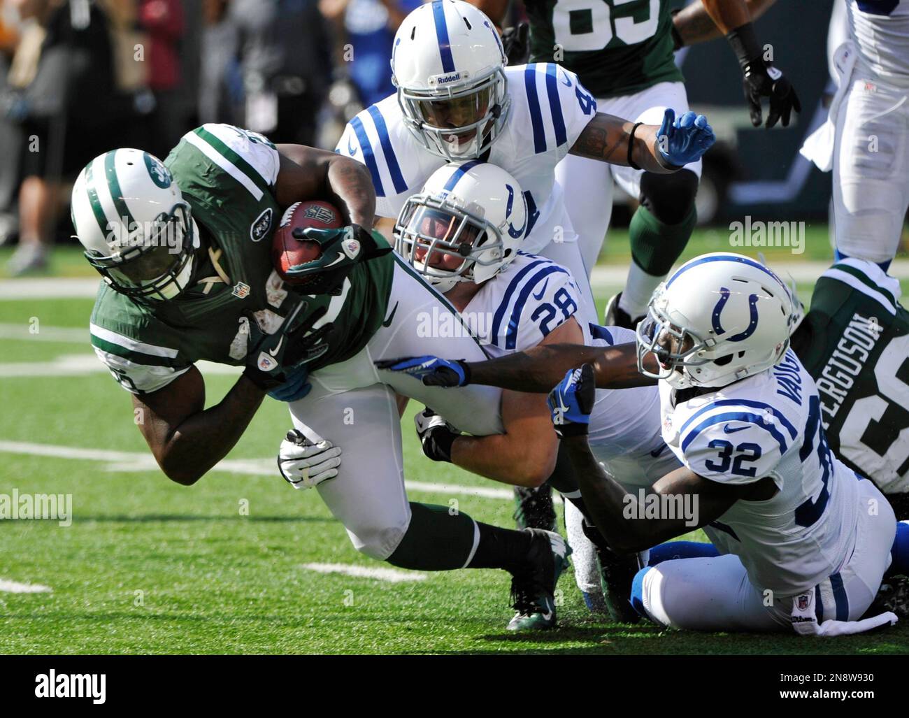 New York Jets running back Shonn Greene (23) is tackled by Indianapolis ...